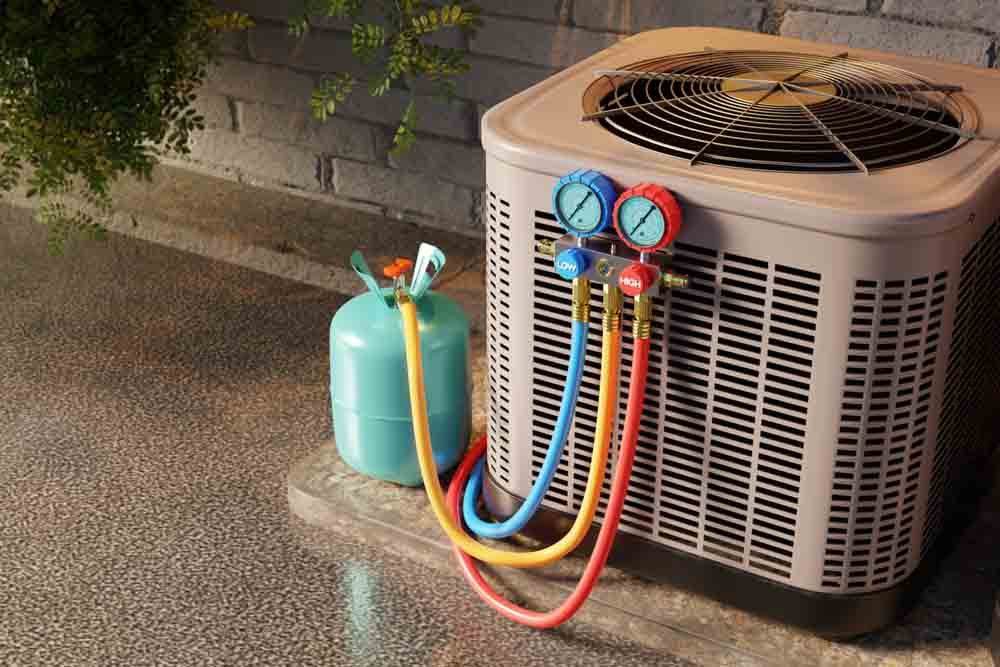 AC unit being refilled with refrigerant