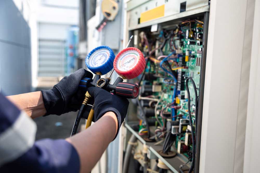 technician tinkering with a control board